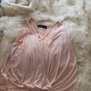 Sleeveless criss-cross low slit top